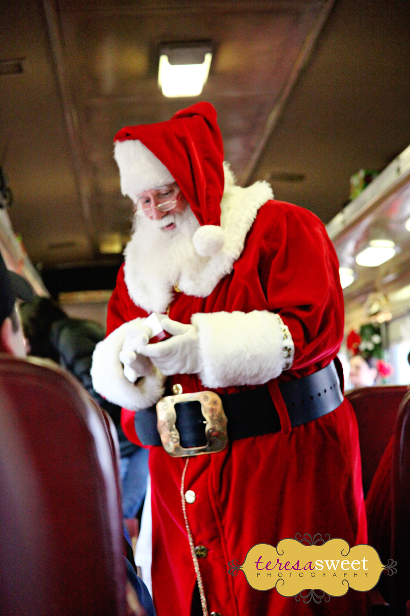 Santa handing out sleigh bells
