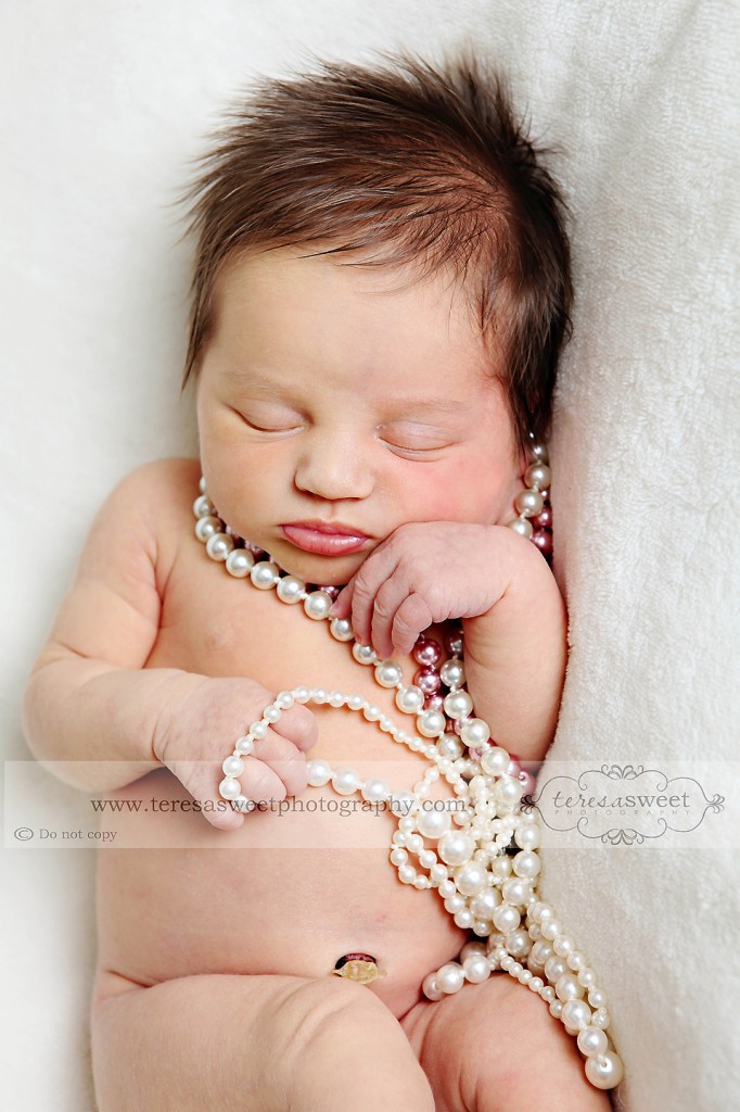 baby girl with pearls